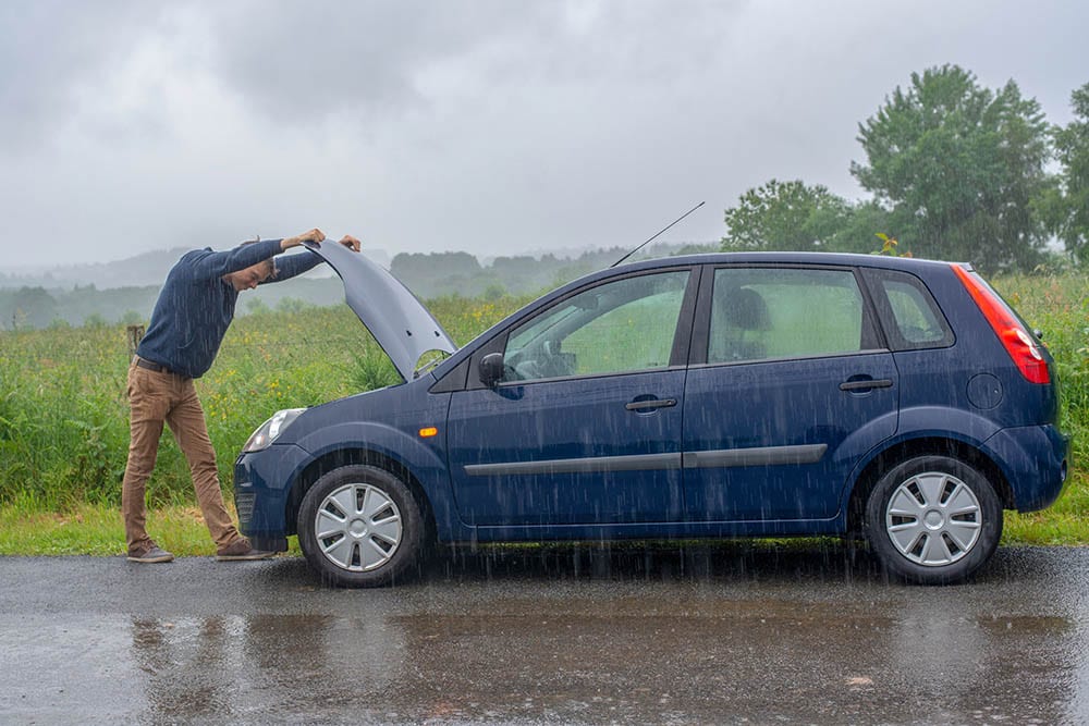 broken car in the rain