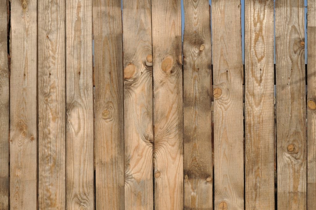 Vertical wood panelling fence