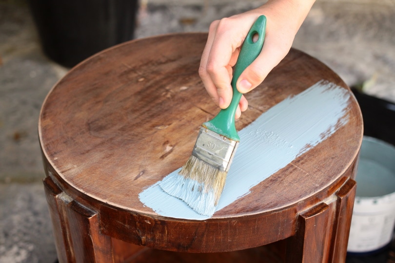 human hand painting furniture