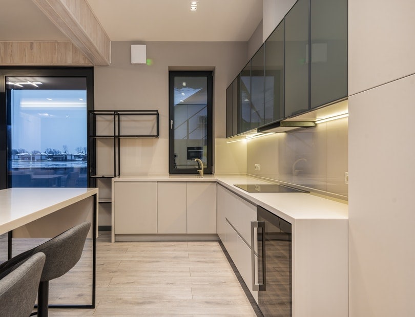 interior of a spacious kitchen with laminated flooring