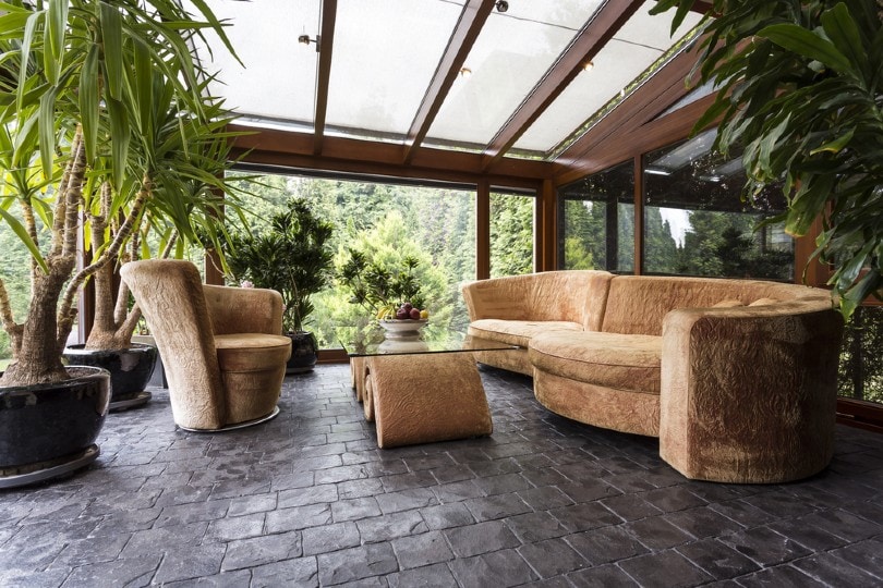 lounge area with big couches and stone floors