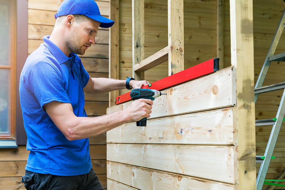 man building a shed