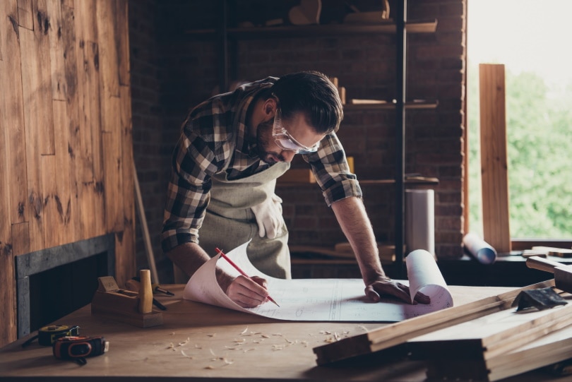 man checking garage plan