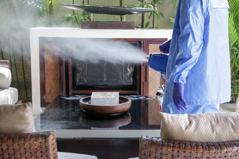 man cleaning and disinfecting
