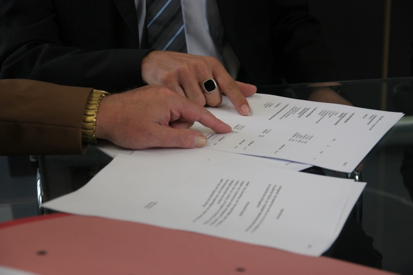 man holding paper