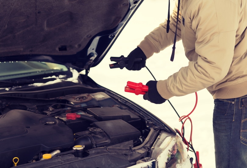 man holding starter cable