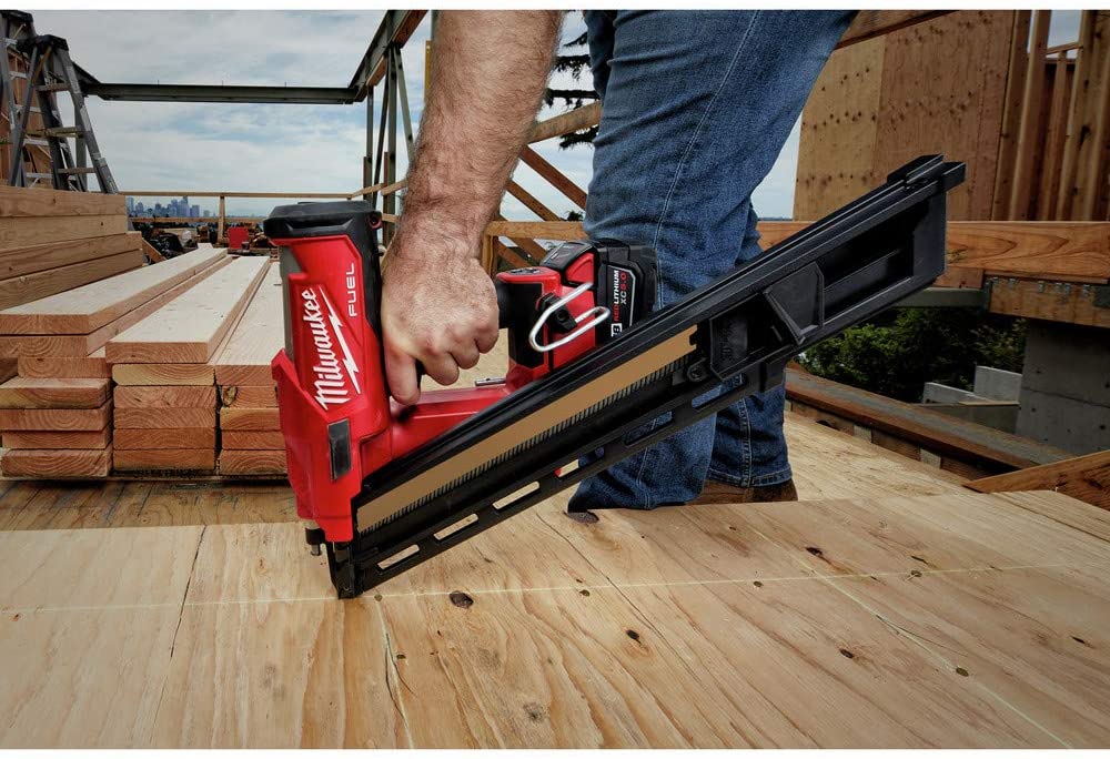 man using Milwaukee 2745-21 M18 FUEL 30-Degree Cordless Framing Nailer