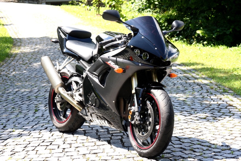 motorcycle parked in pathway