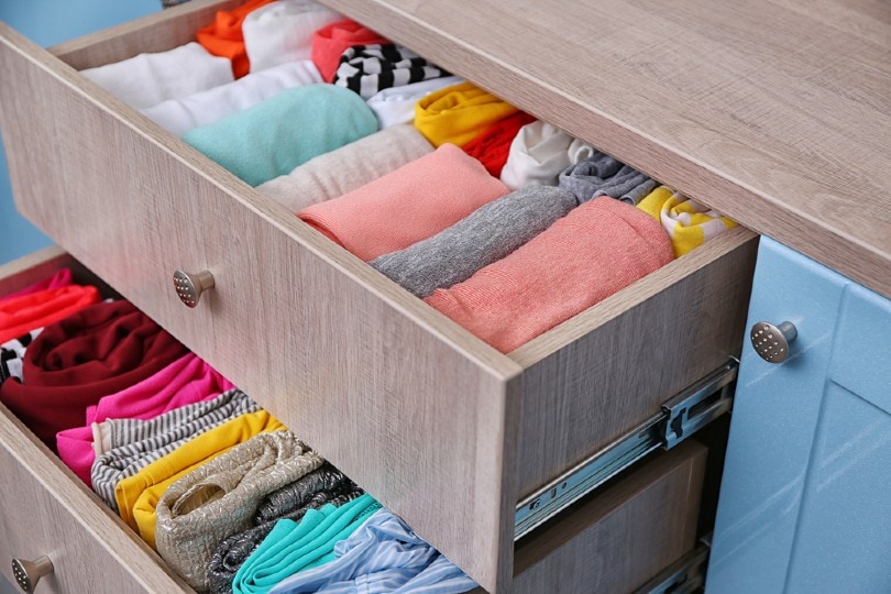 neatly folded clothes in a drawer