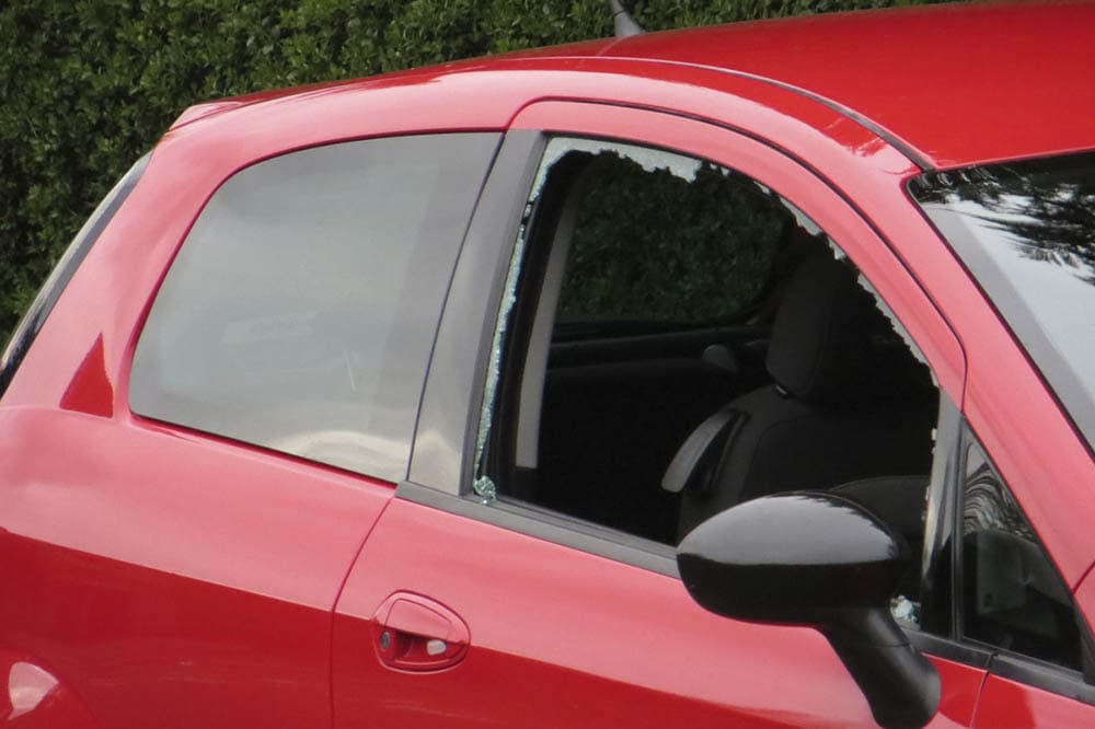 Red car with broken car window