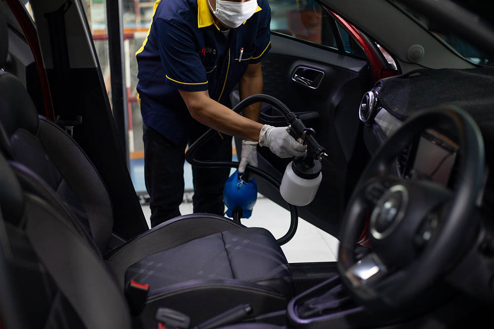 spraying water inside the car