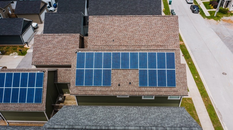 top view of houses with and without solar panels