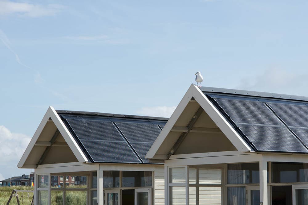 two houses with solar panels on the roof