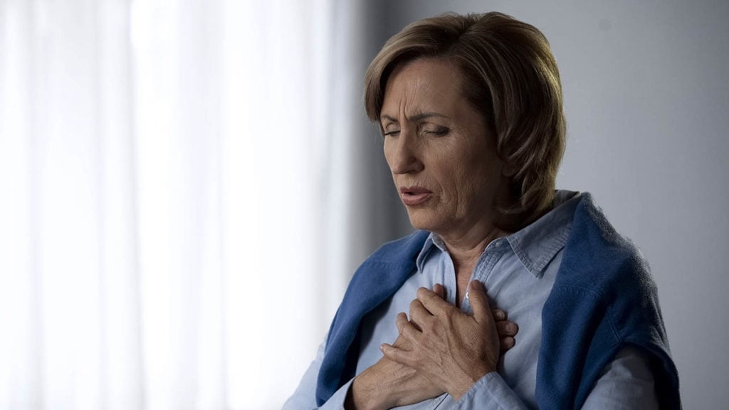 woman having breathing difficulties