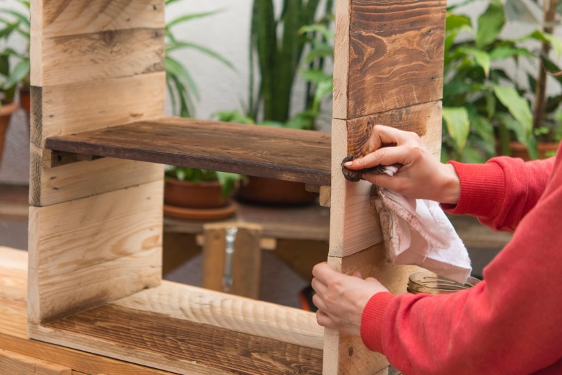 woman restoring furniture