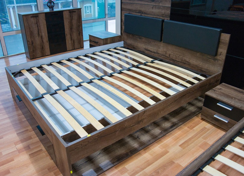 wooden bed slats without a mattress in the room