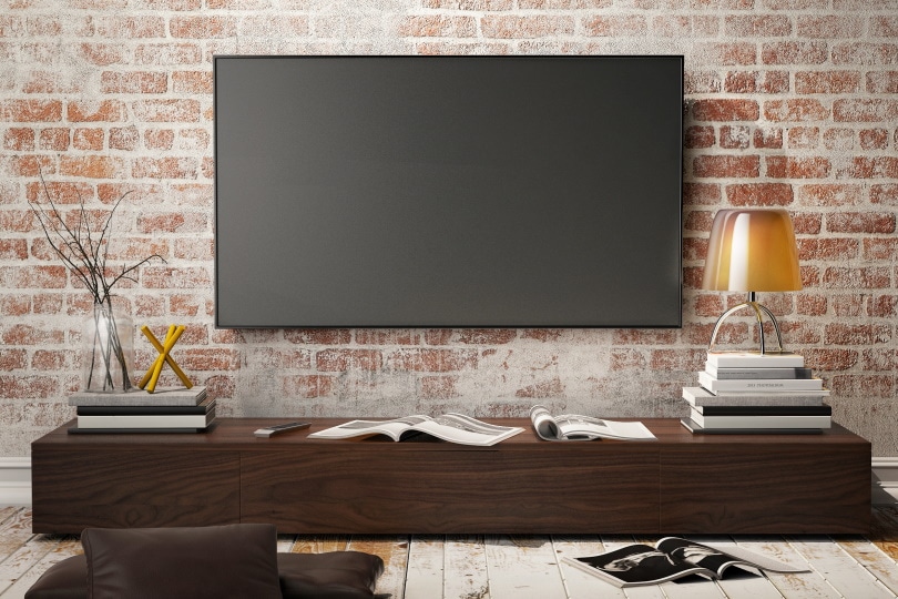 TV mounted on brick wall