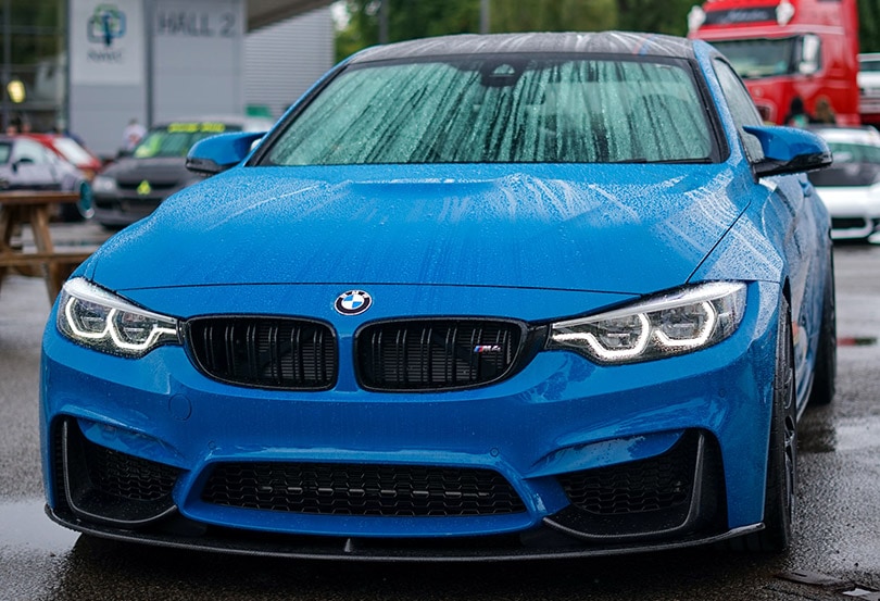 blue bmw car in a car wash