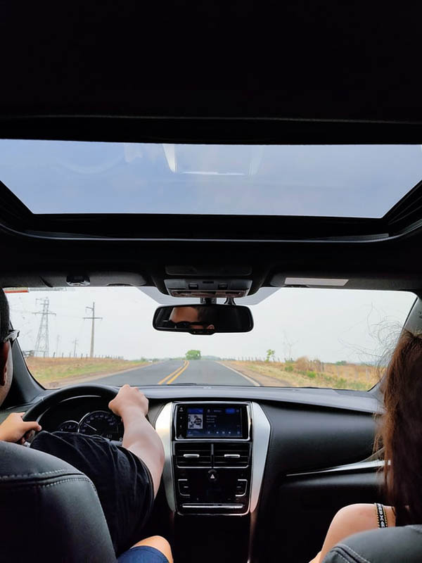 couple riding a car with moonroof