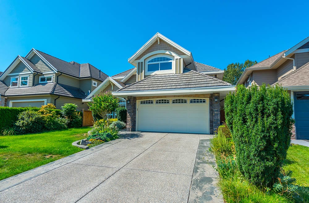 house with paver driveway