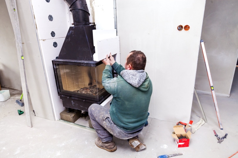 installing fireplace