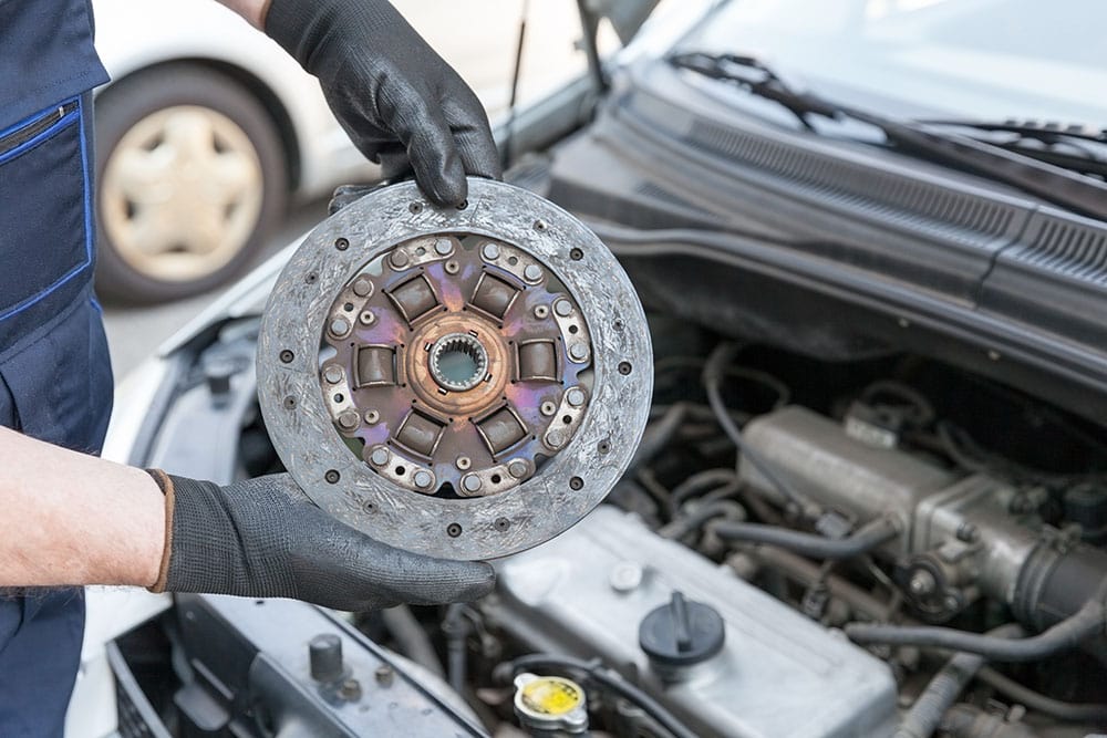 mechanic holding Clutch disc