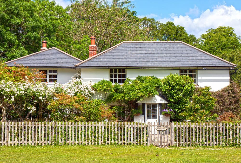 rustic countryside house with fence