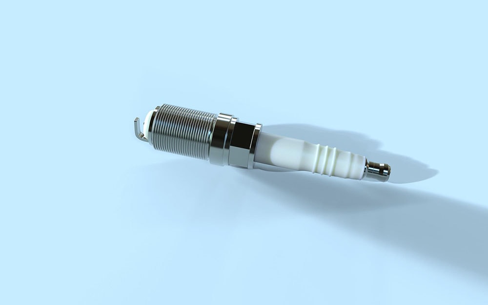 spark plug on blue background