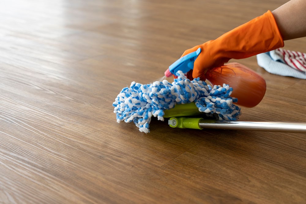 spraying mop with cleaner spray