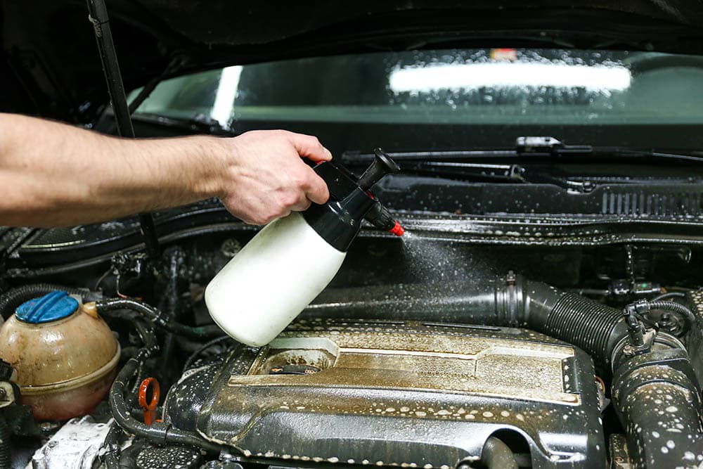 spraying on car engine