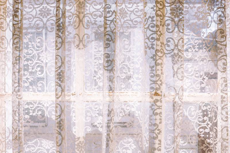 vintage lace curtains and sunlight through window