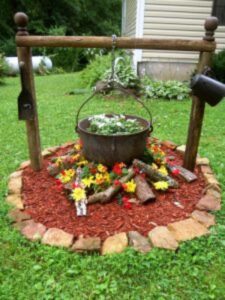 DIY antique cauldron flower bed design