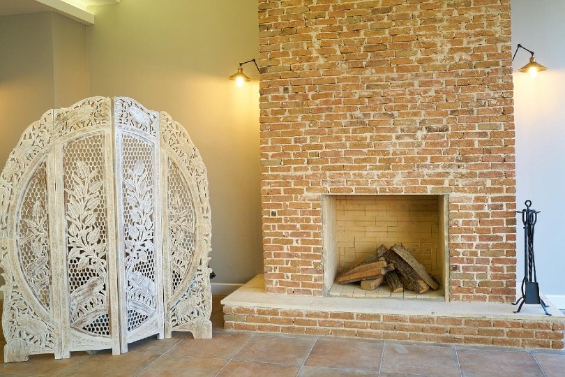 a brick fireplace in an old home