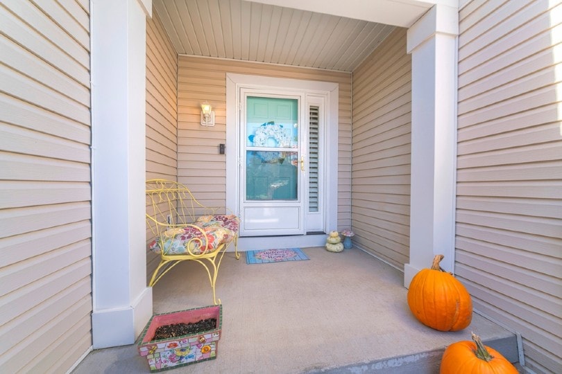 beautiful house with white glass storm door