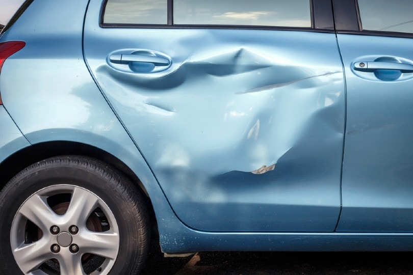 car with a huge dent on the side