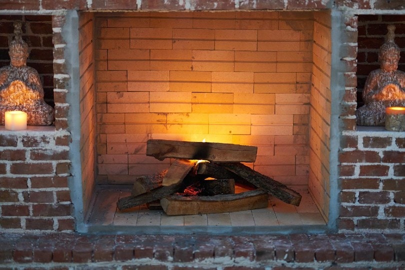 fire wood in a brick fireplace