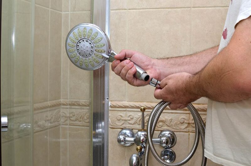 man installing new shower