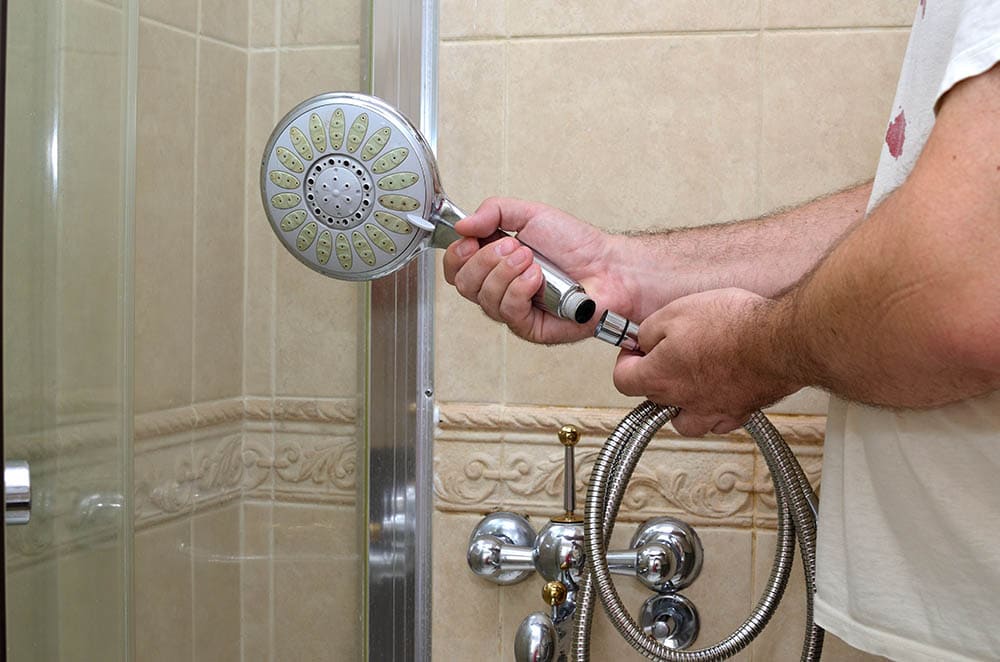 man installing new shower