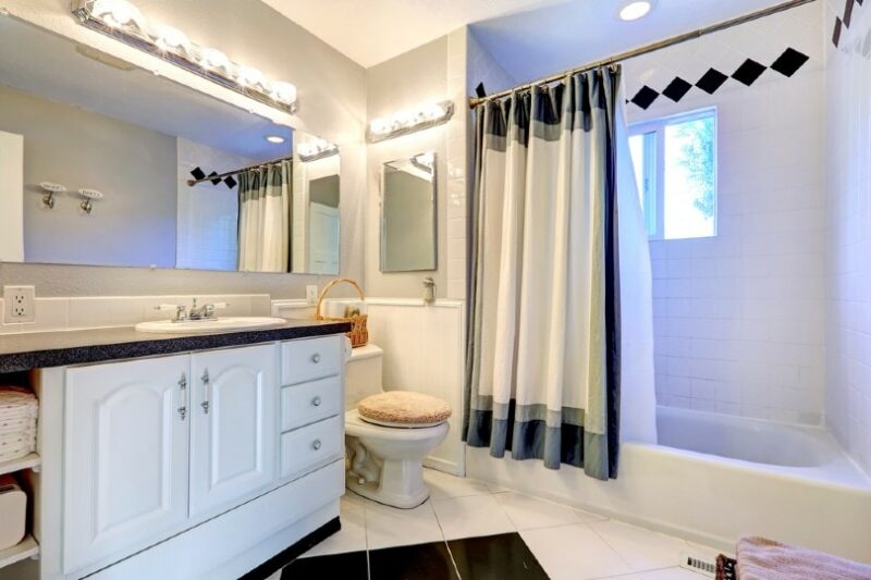 modern bathroom with shower curtain liner in the bath
