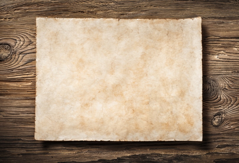 parchment paper in wooden background