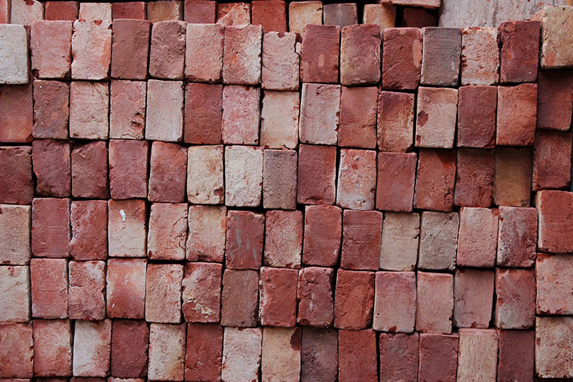 stacked used bricks