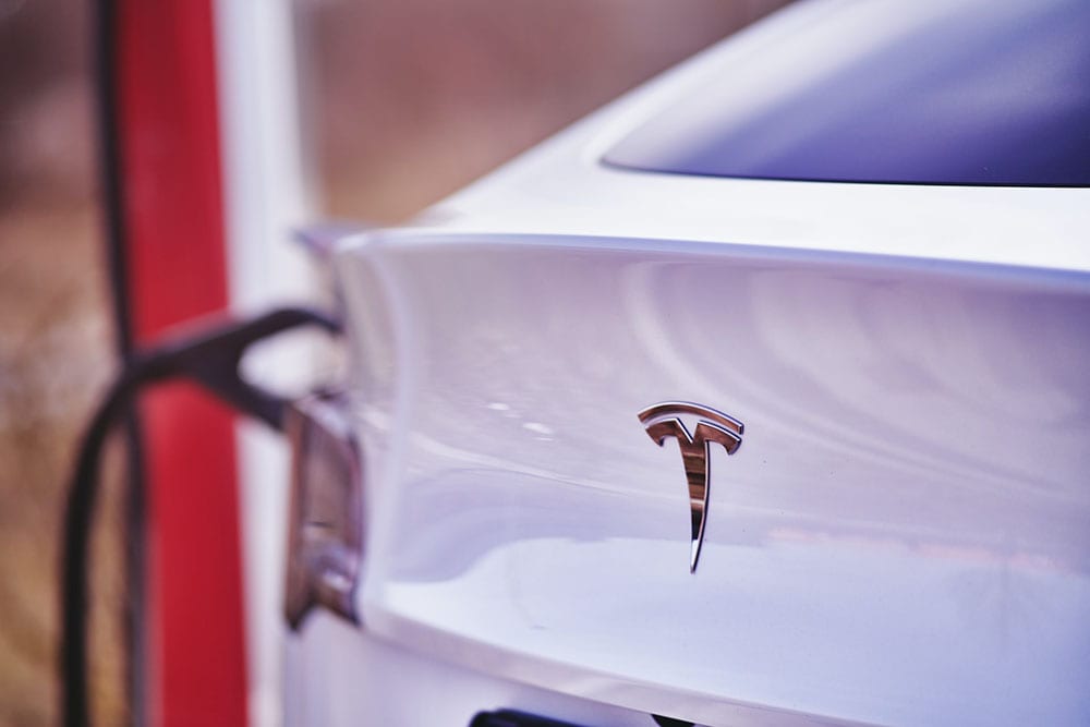 white tesla car charging