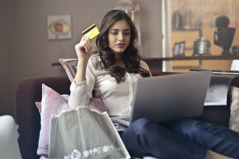 woman holding credit card