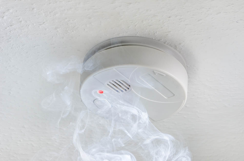 a smoke detector in the ceiling