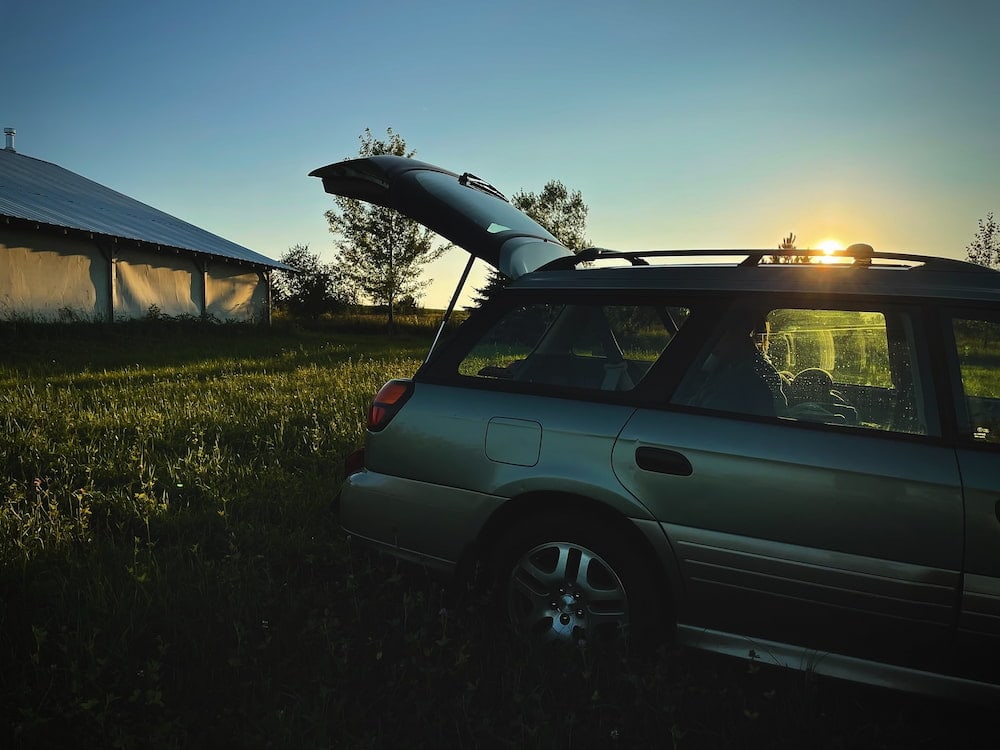 car with roof racks on a sunset