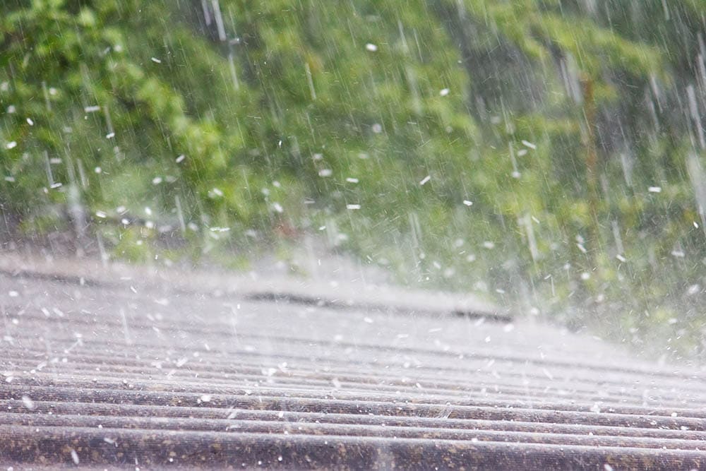 close up hail falls on the roof