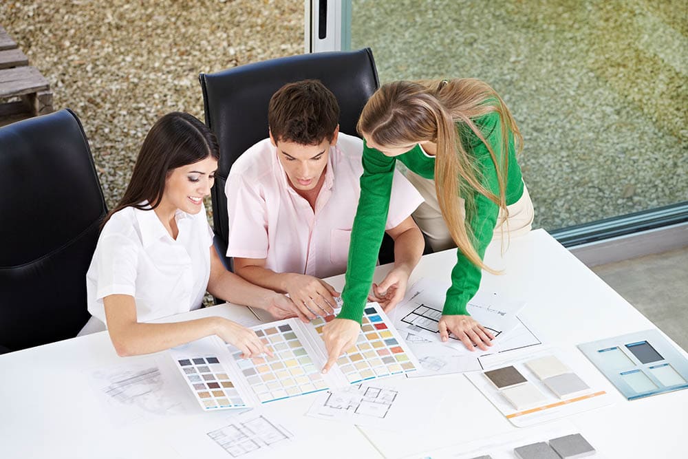 couple discussing with interior designer