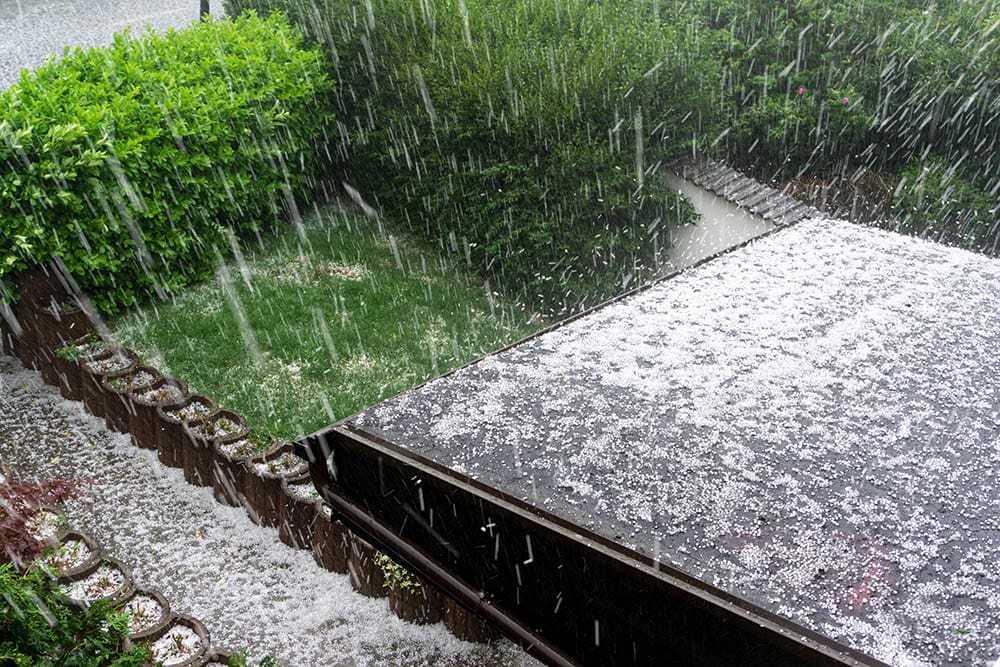 Hail falls on a house during storm