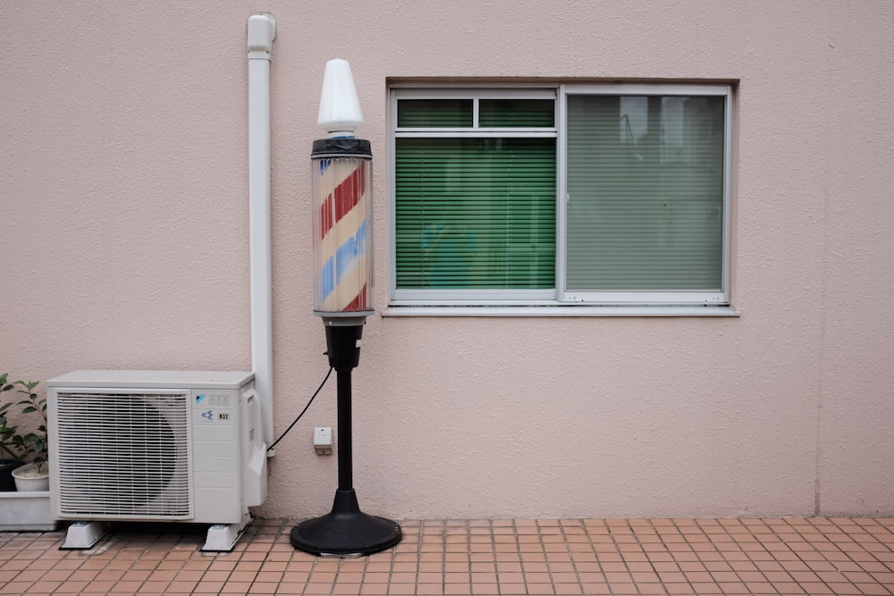 heat pump beside barbers lamp