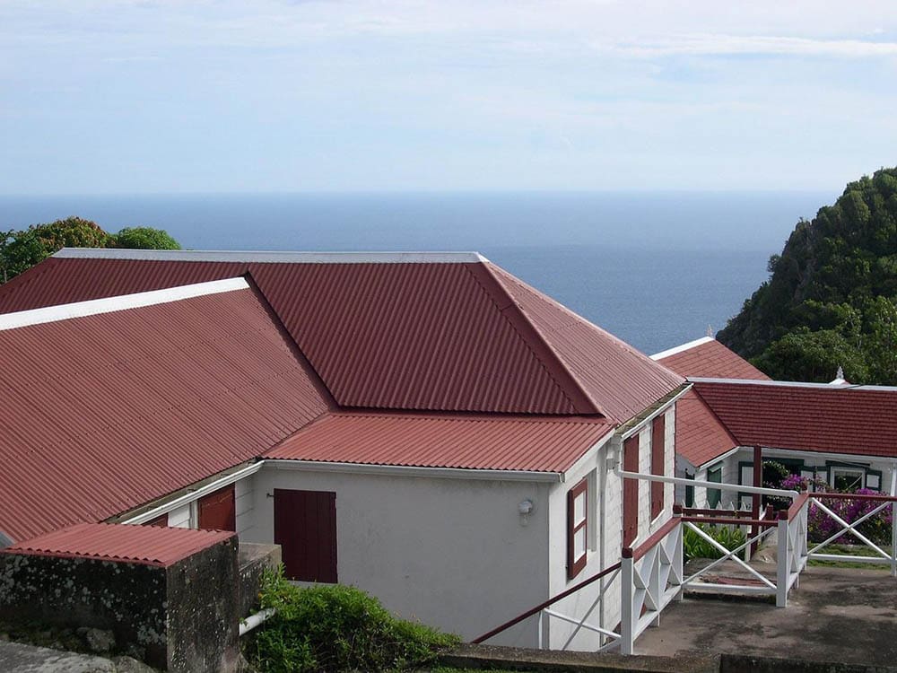 house with red metal roofing